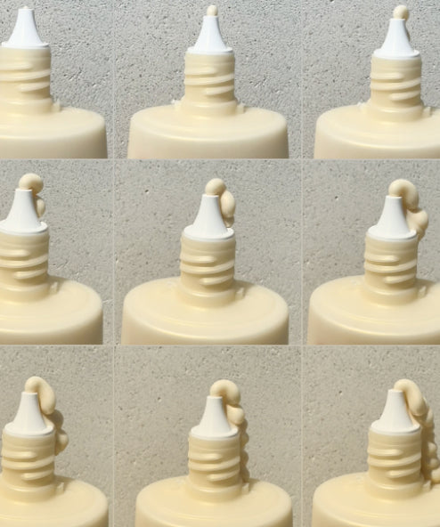 A 9-frame timelapse of Super Drops Niacinamide Golden Glow Serum being squeezed out of the bottle.