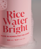 Rice Water Bright Essential Shampoo closeup covered in bubbles.
