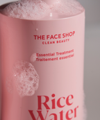 Rice Water Bright Essential Treatment closeup lightly covered in bubbles.