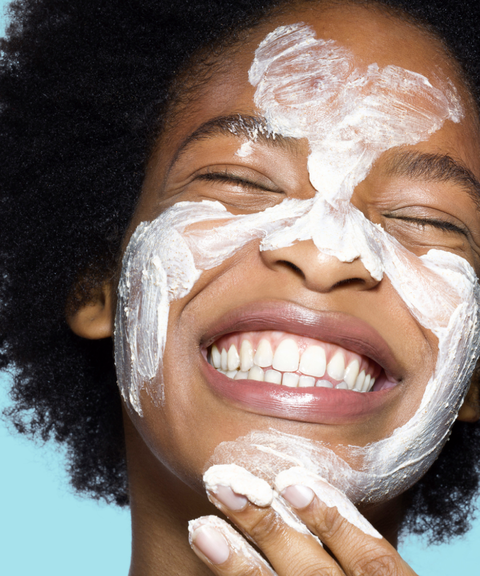 An image of a model applying the Super Knights Purifying Clay Mask to her face.