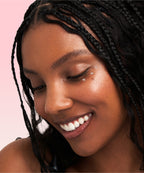 Model applying The Face Shop Rice Water Bright Vegan Eye Cream to under-eye area – Achieve a refreshed and radiant look
