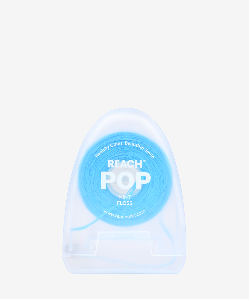 A container of Reach POP Floss Mint on a white background