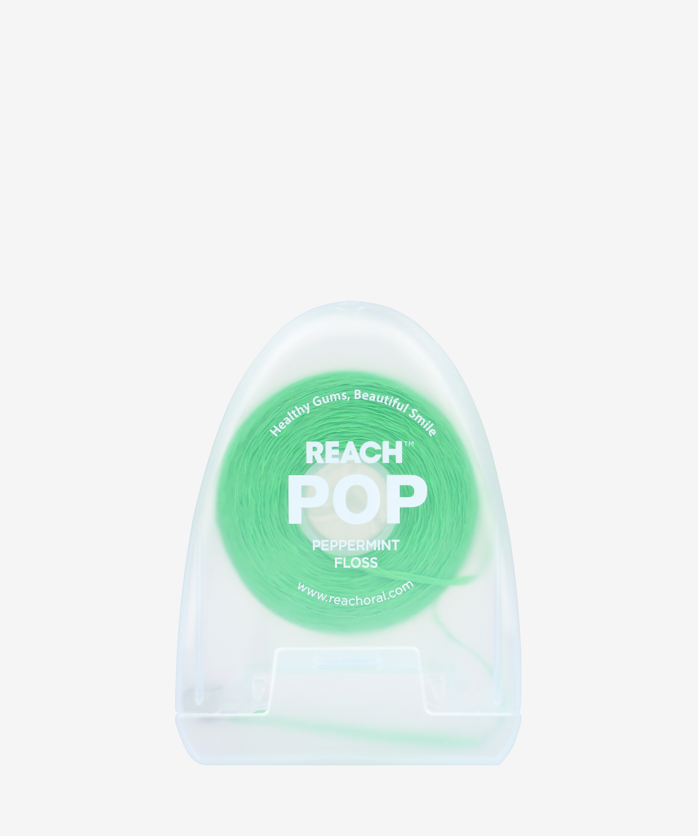A container of Reach POP Floss Peppermint on a white background