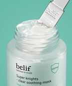 An image showing the applicator and open jar of the Super Knights Clear Soothing Mask.