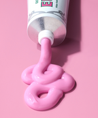A picture of the pink toothpaste getting out of the tube of the Euthymol Whitening Toothpaste.