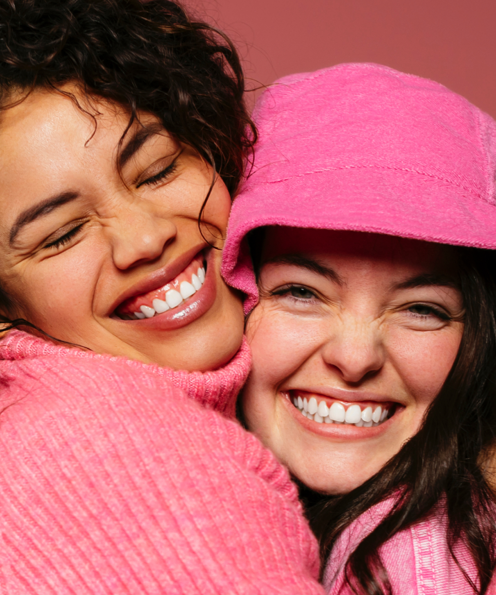 An image of two smiling models.