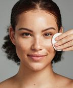 An image of a model using the Tea Tree Toner Pads.